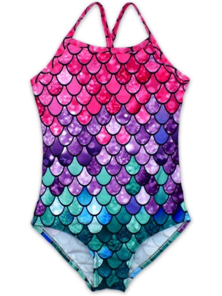 Colorful mermaid-scale print one-piece swimwear for kids, gradient pink-purple-teal with glittery texture and halter straps.