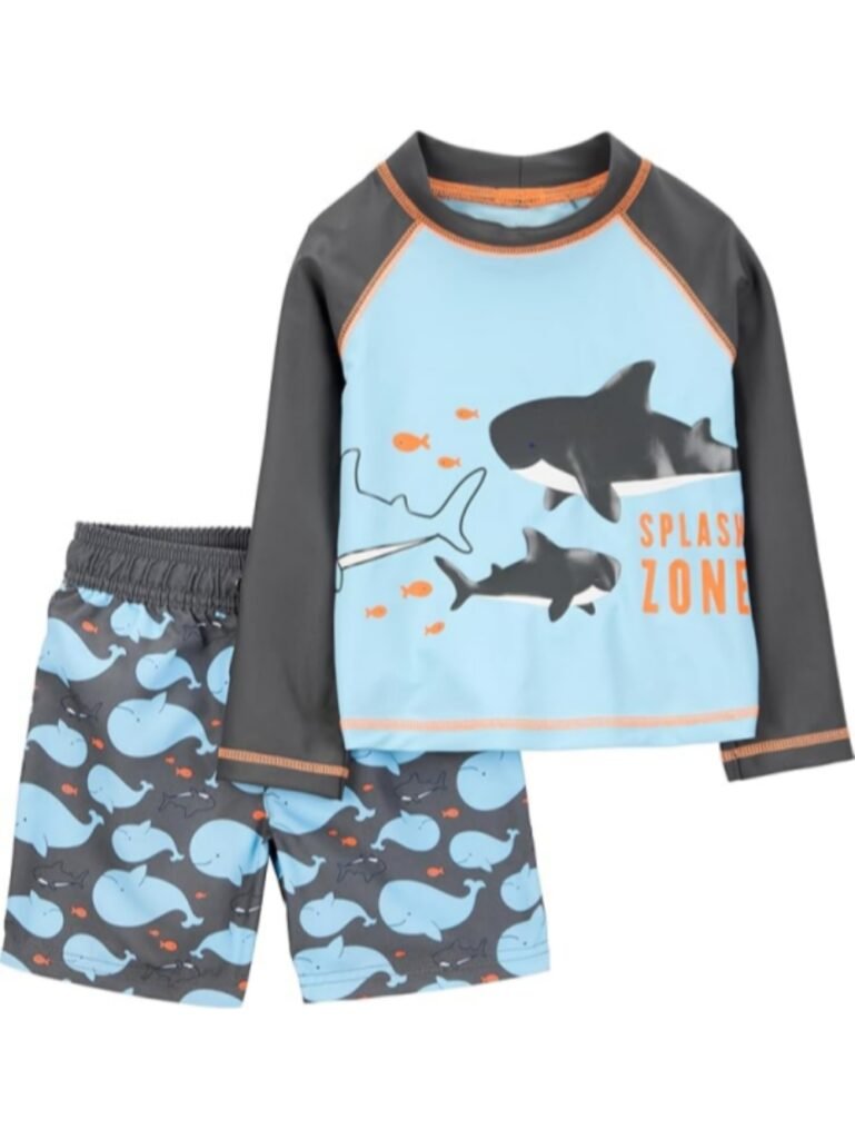 Blue and gray long-sleeve kids' swim shirt with shark print and "Splash Zone" text, paired with matching whale-patterned swim shorts for children.