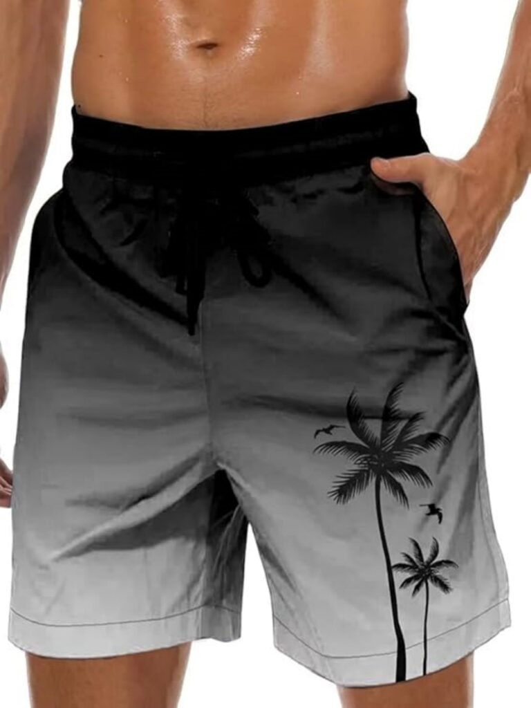 Black and gray gradient swim trunks with palm tree print, elastic waistband, drawstring, and side pockets.