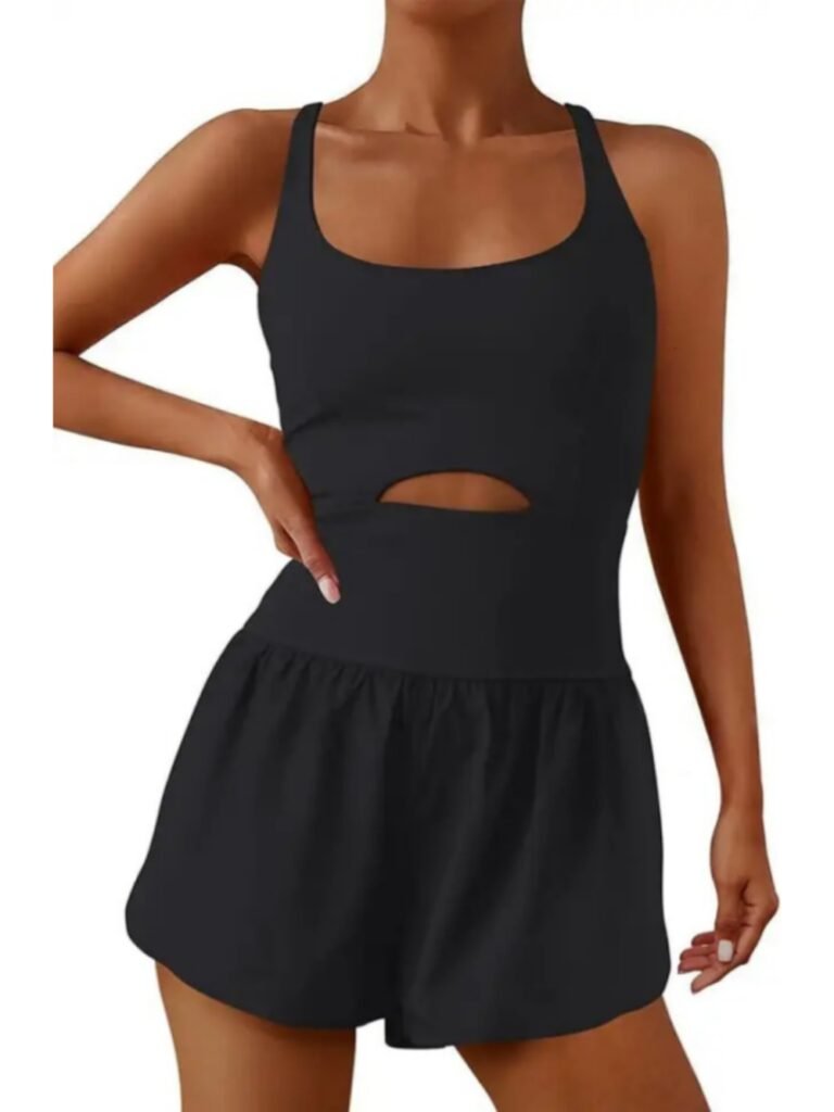 Black sleeveless cutout tank top with ruched waist and matching high-waisted shorts, model posing against white background.