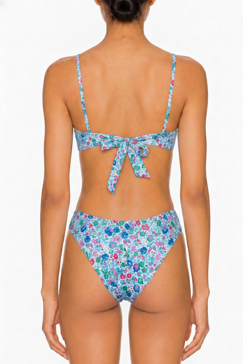 Back view of a floral print bikini set featuring a tie-back bralette top and cheeky cut bottoms.