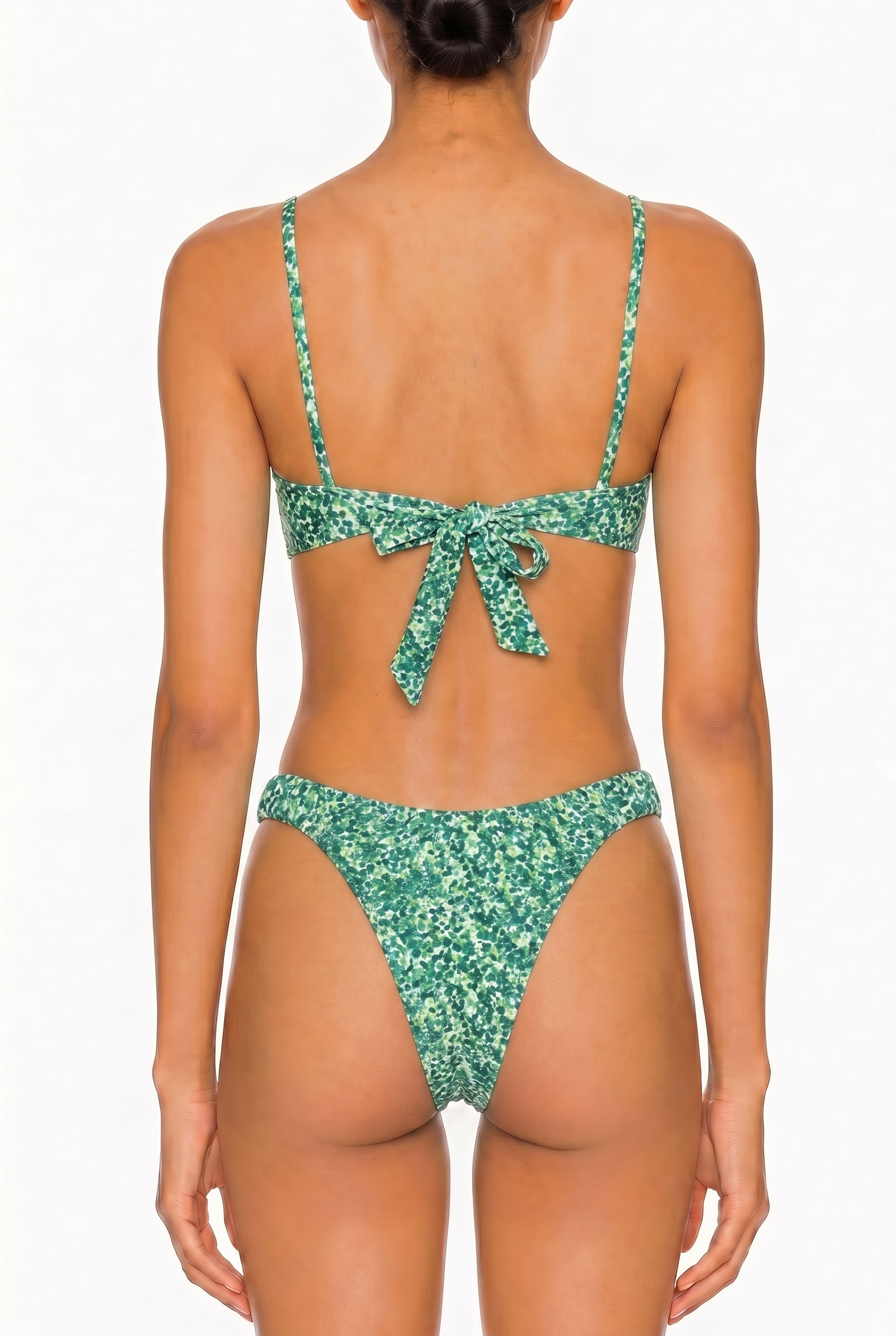 Back view of a green floral print bikini set featuring a tie-back bralette top and cheeky cut bottoms.