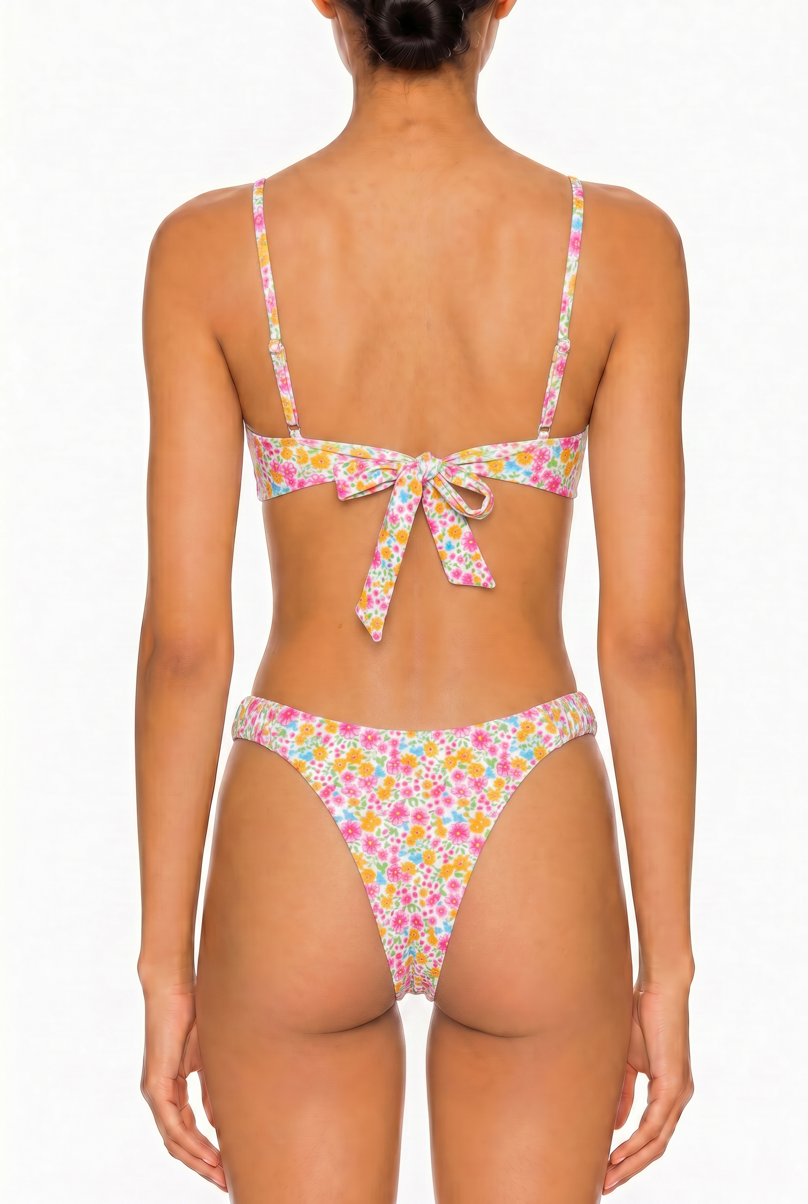 Back view of a floral print bikini set featuring a tie-back bralette top and cheeky cut bottoms.