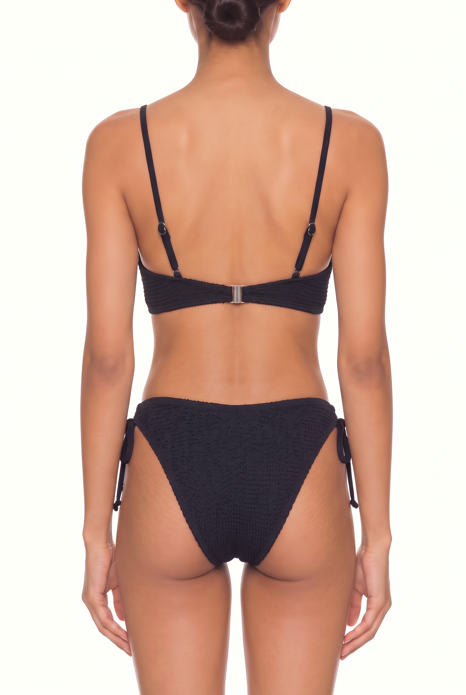 Back view of a textured black two-piece bikini set with adjustable straps, hook closure, and tie-side bottoms.