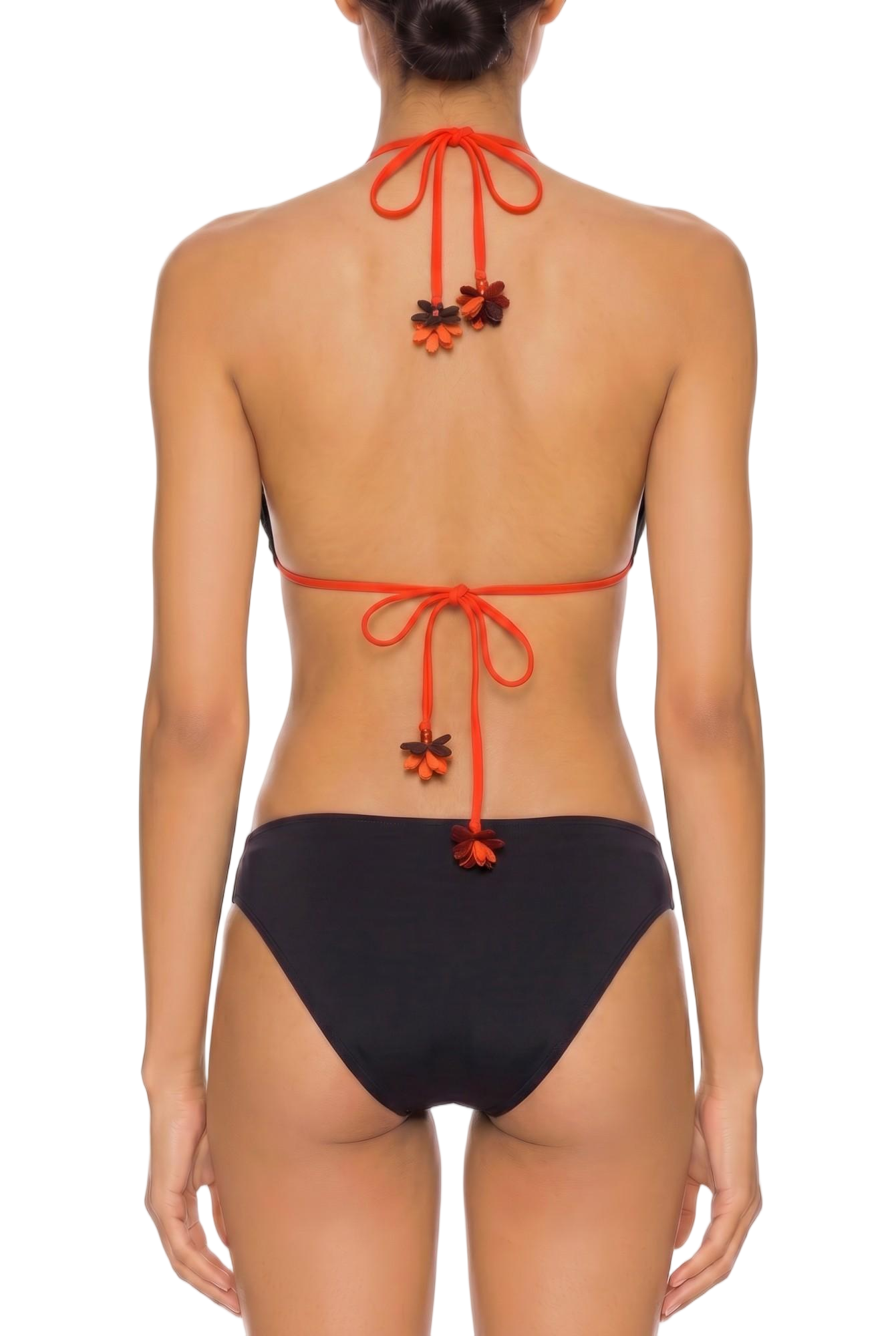 Back view of a black monokini with orange halter ties and floral appliques.
