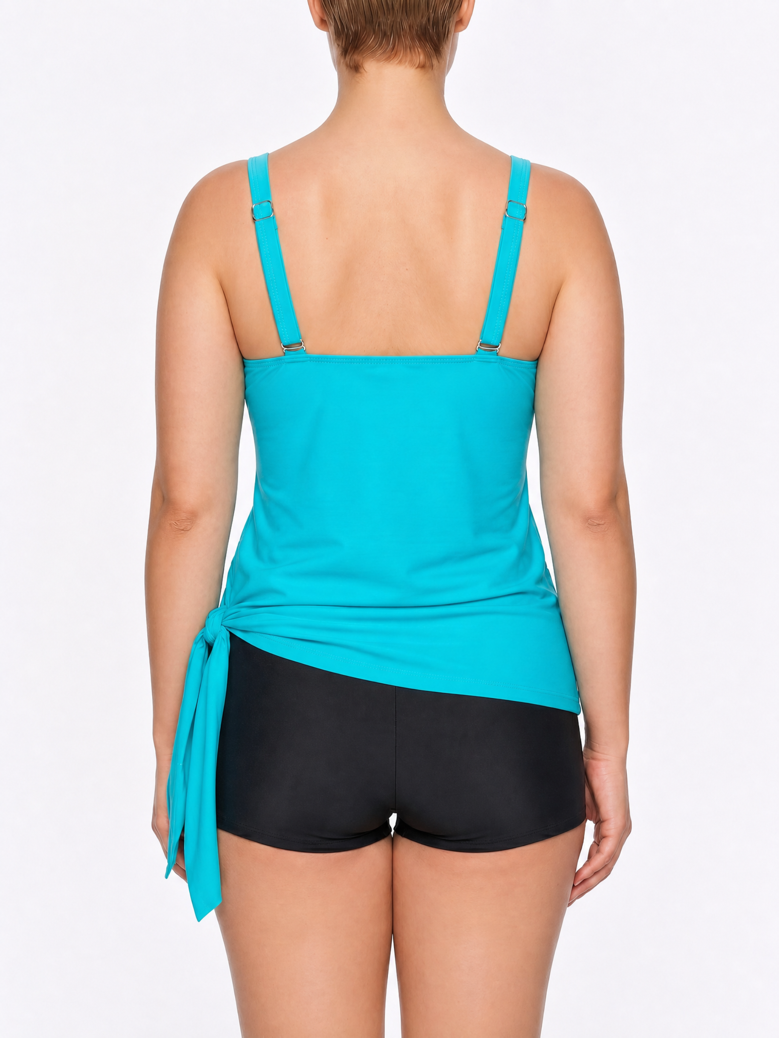 Back view of a woman wearing a turquoise tie-side tankini top and black boyshorts.