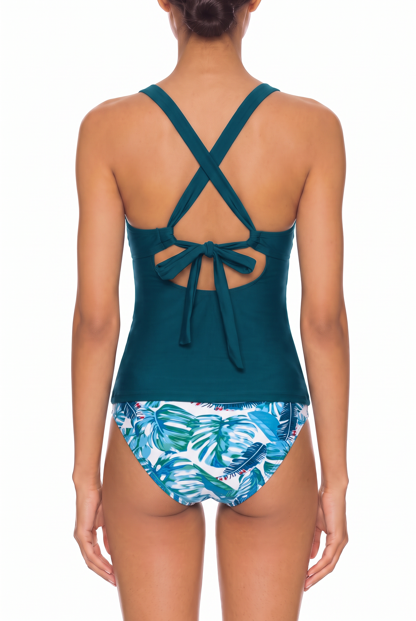 Back view of teal tankini top with crisscross tie straps and tropical print bikini bottoms.