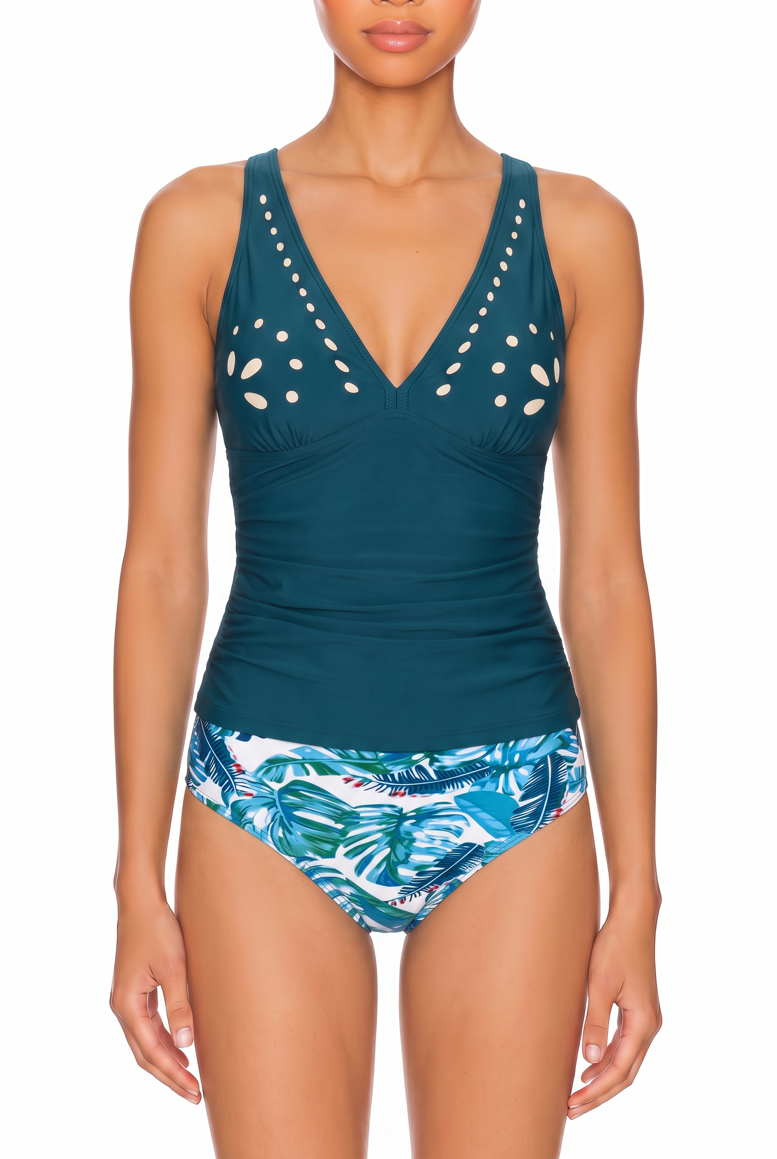 Teal tankini top with plunge neckline, bust cutouts, and ruched midsection paired with tropical print bikini bottoms.