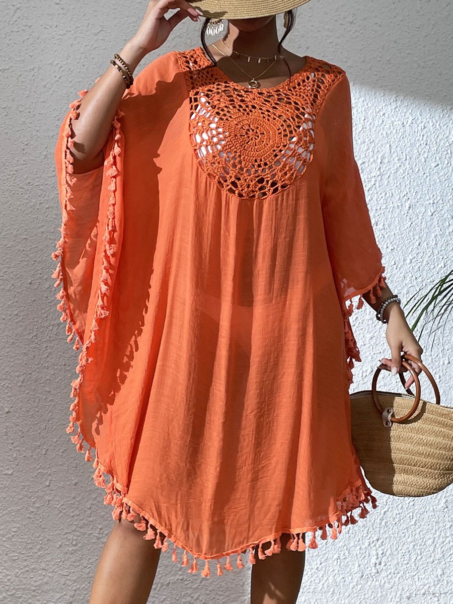 Orange loose-fitting kaftan cover-up featuring a crochet yoke neckline and tassel trim along the wide sleeves and hem.
