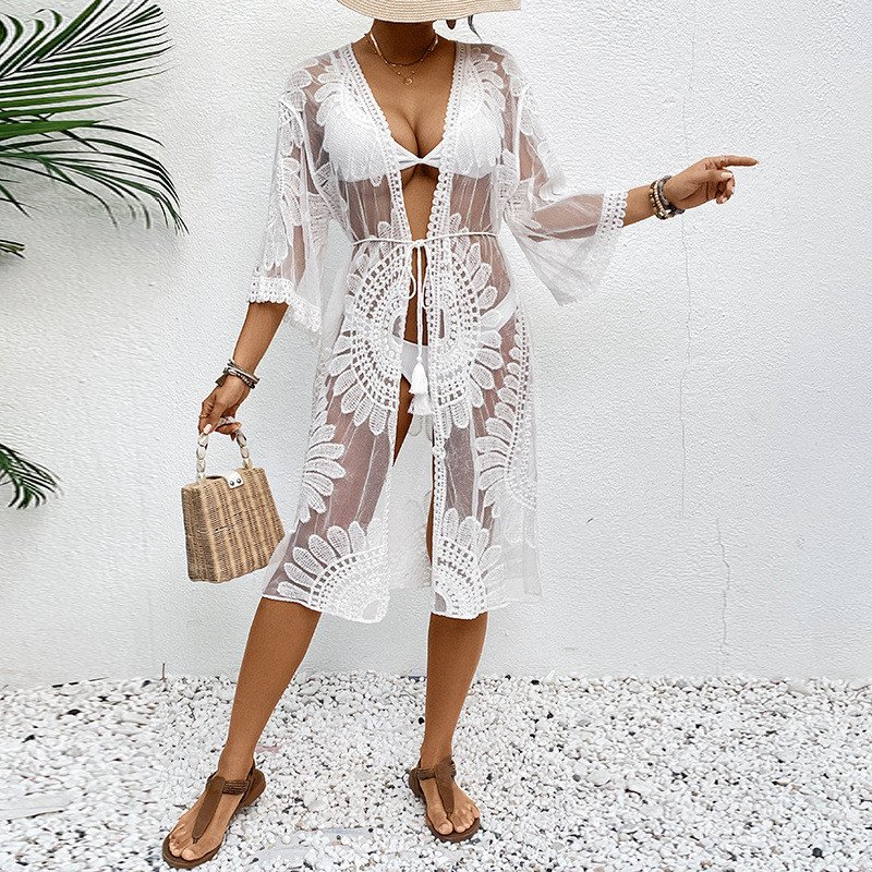 White sheer open-front kaftan cover-up featuring floral cutout patterns, deep V-neckline, and bell sleeves.