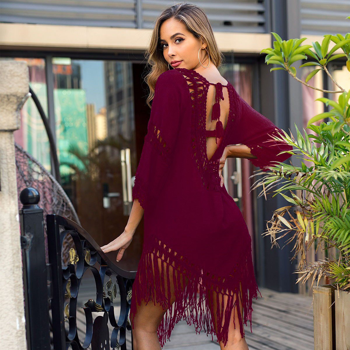 Burgundy crochet trim fringed cover-up tunic with open back and bell sleeves.