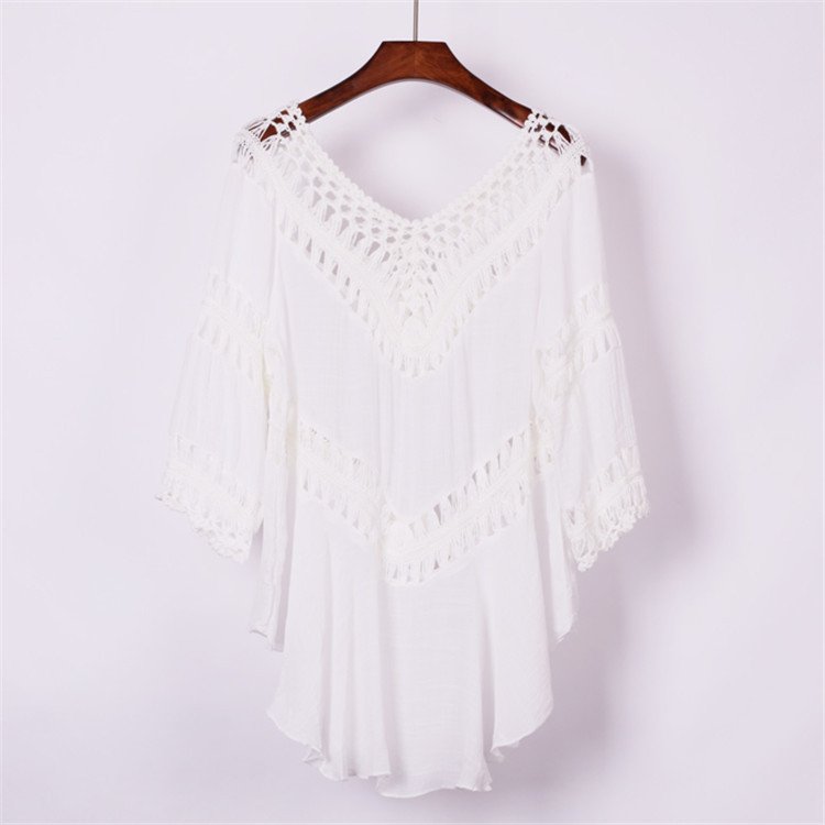 White women's V-neck crochet cover-up tunic with three-quarter sleeves and high-low hem.