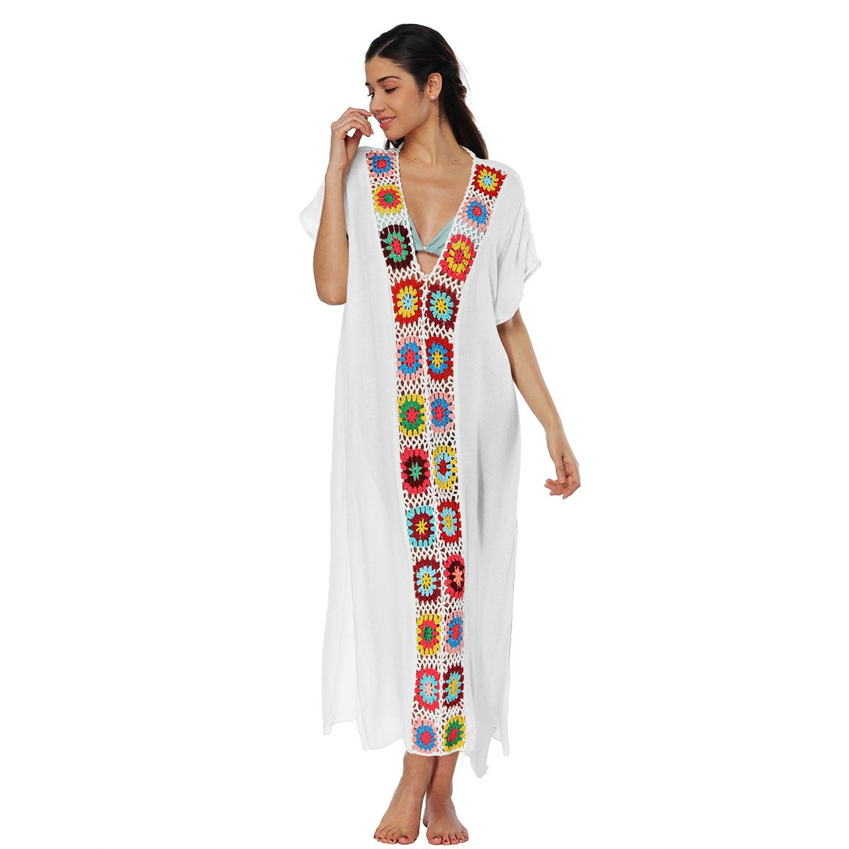 White loose-fitting caftan cover-up with short sleeves, deep V-neckline, and colorful floral crochet trim down the center front.