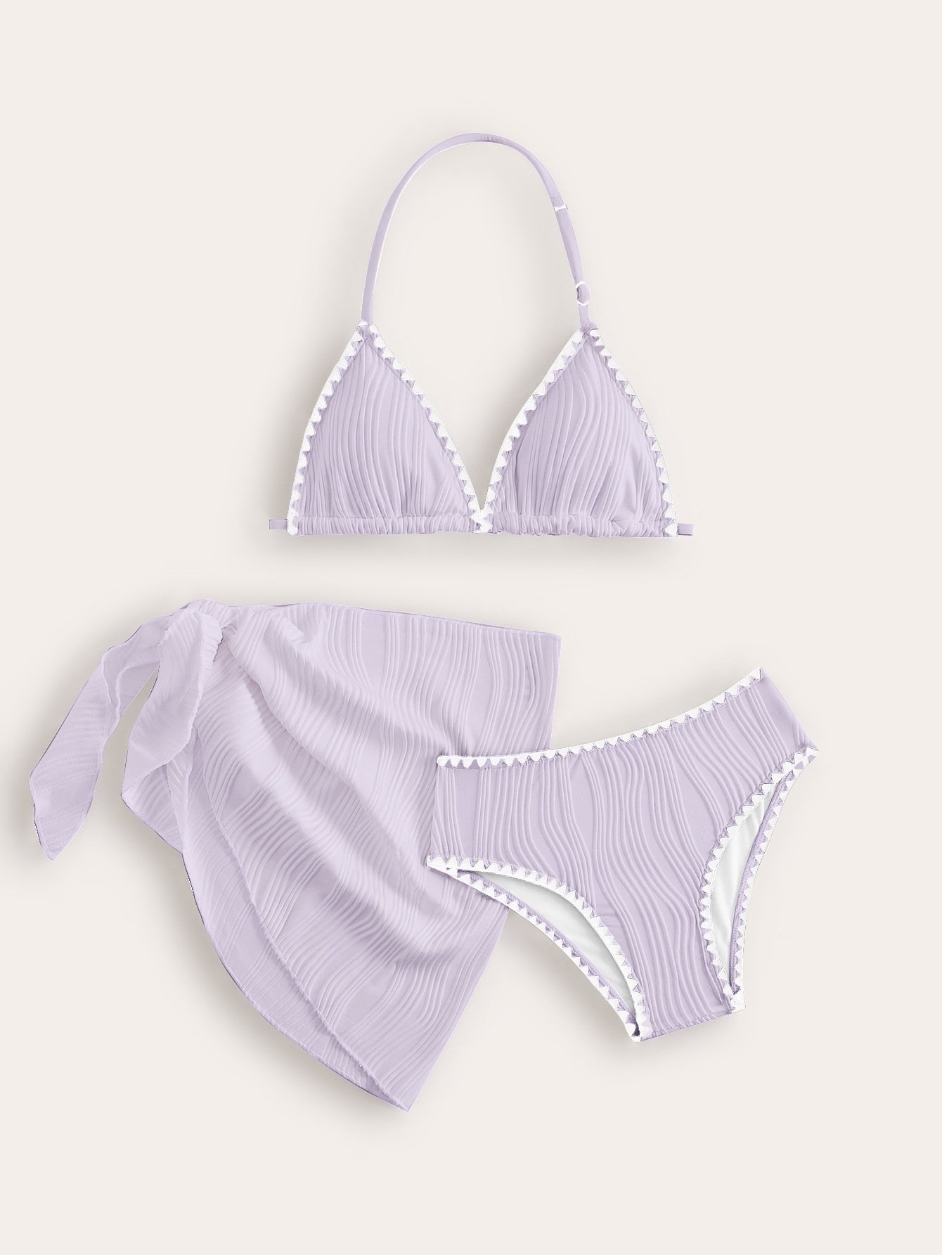 Lavender pleated three-piece girls' bikini set with halter triangle top, bottoms, and side-tie wrap skirt.