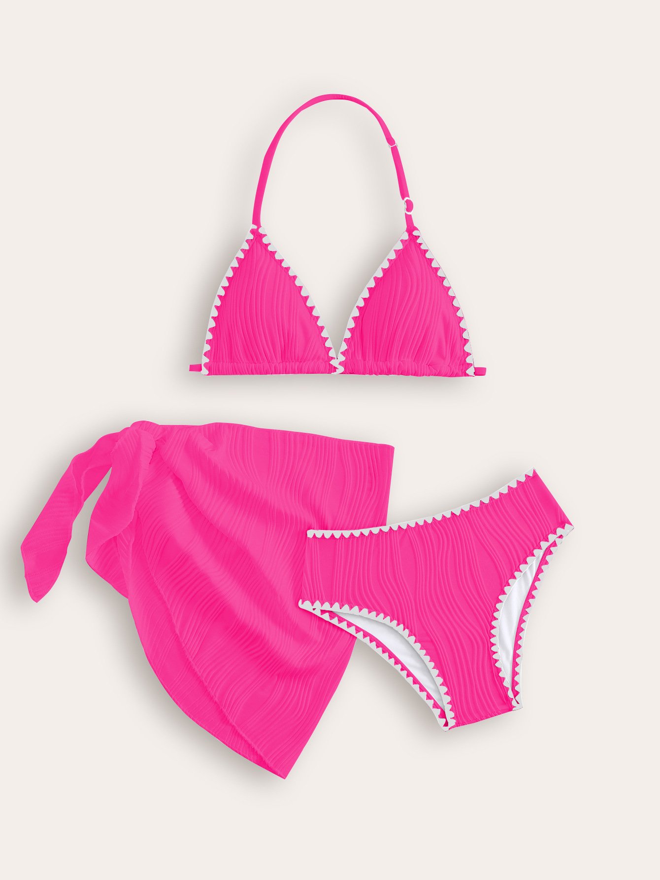 Pink girls' three-piece bikini set with halter triangle top, bottoms, and wrap skirt featuring white trim.