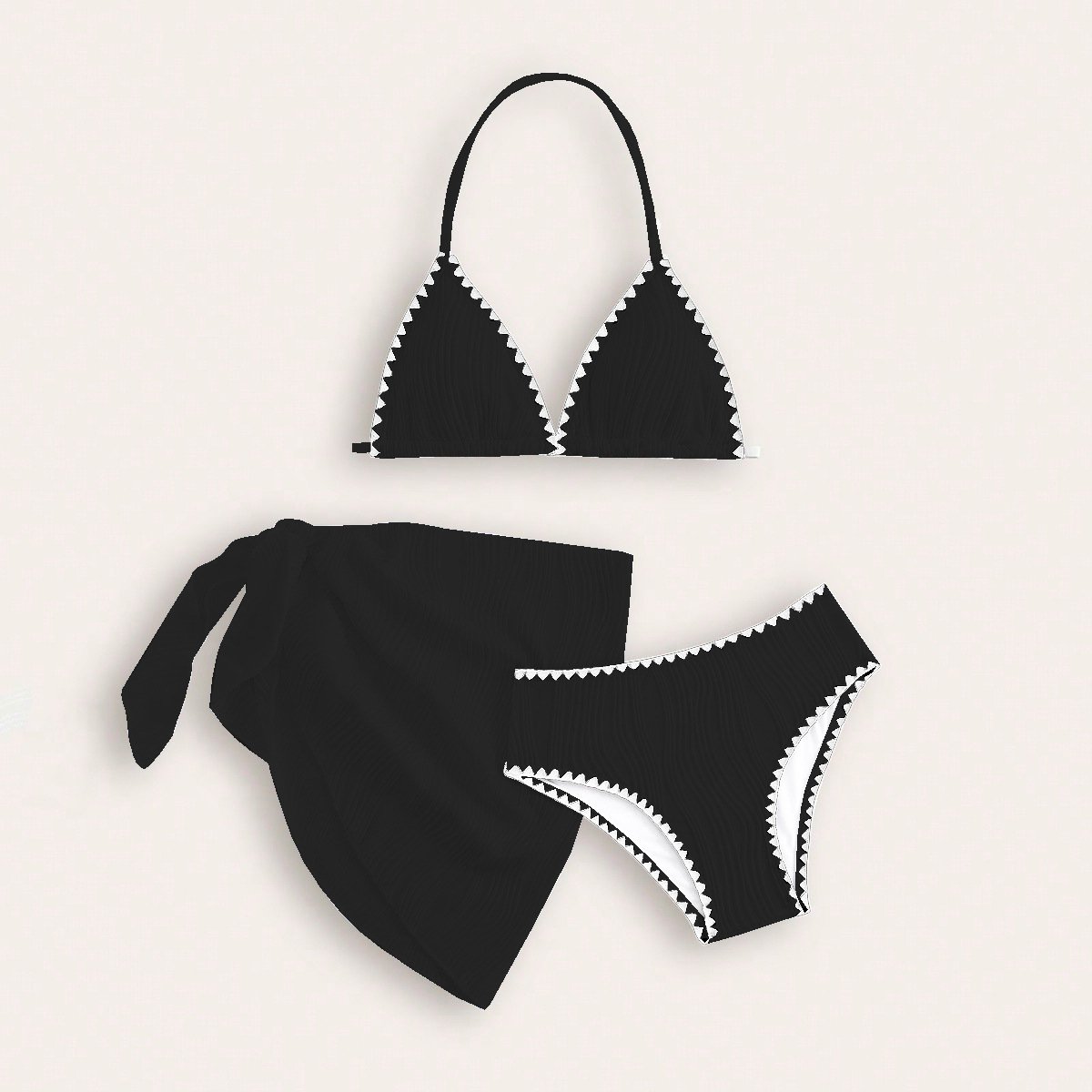 Black girls' three-piece halter triangle bikini set with white zigzag trim and wrap skirt.