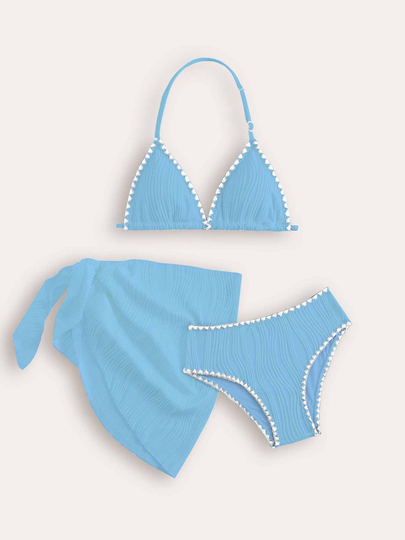 Light blue girls' three-piece bikini set with halter triangle top, bottoms, and wrap skirt featuring white contrast trim.
