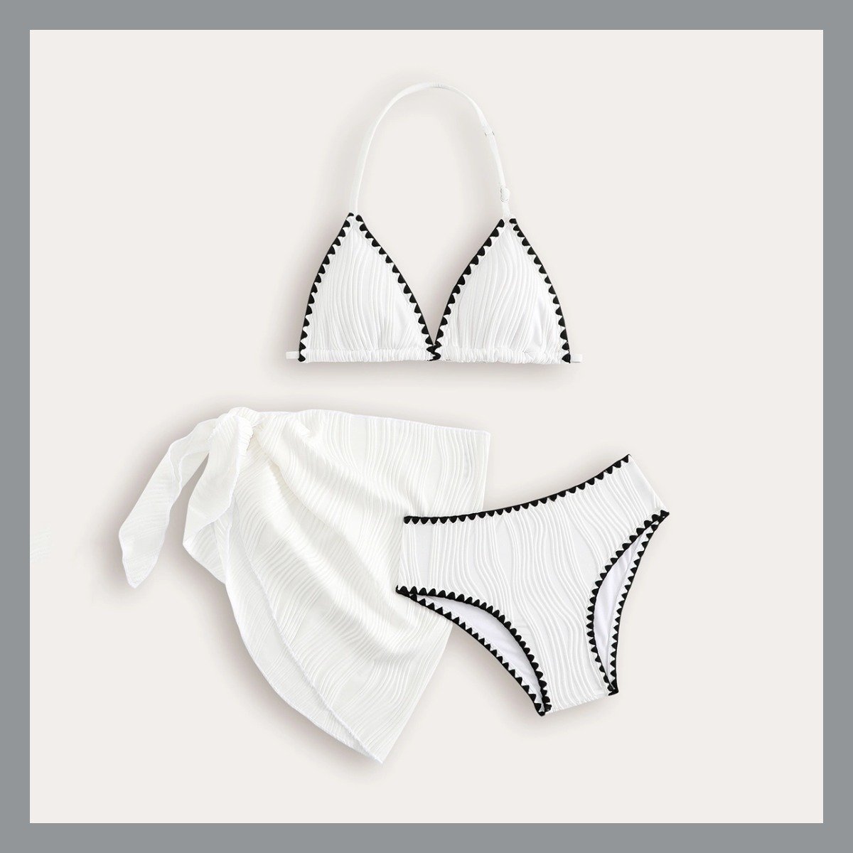 White girls' three-piece bikini set with black trim, featuring a halter triangle top, bottoms, and a side-tie wrap