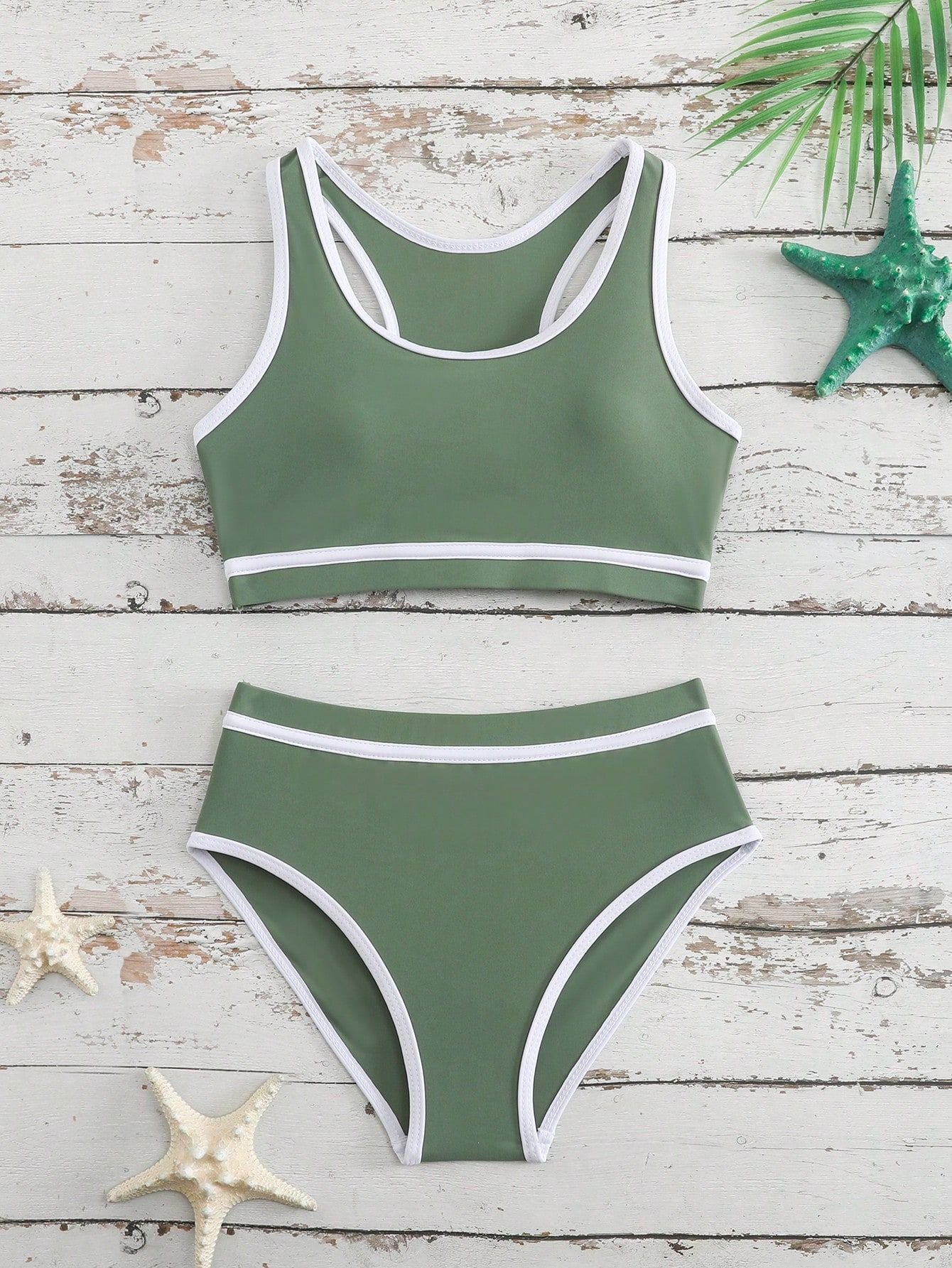 Green and white girls' two-piece swimsuit set featuring a racerback crop top and high-waist bikini bottoms with contrast