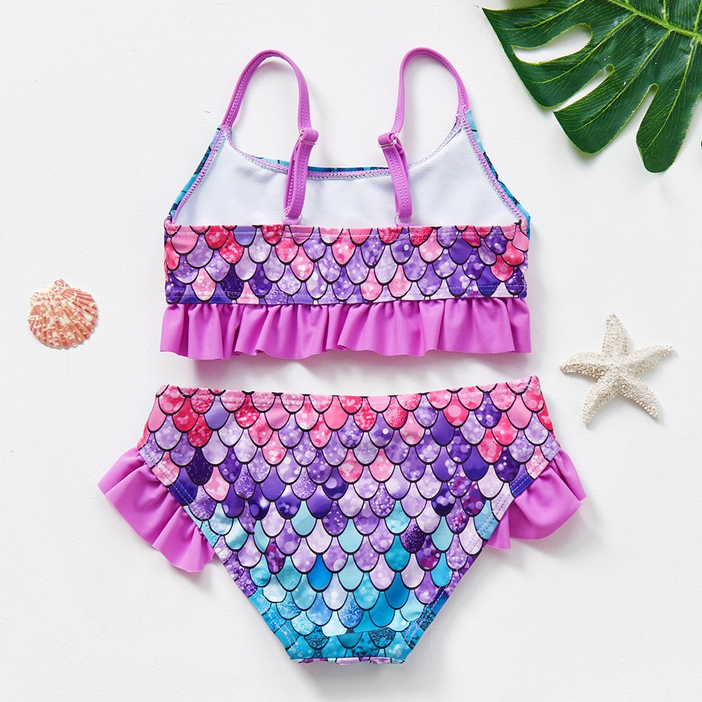 Girls' mermaid scale print tankini set with adjustable straps and ruffled hem.