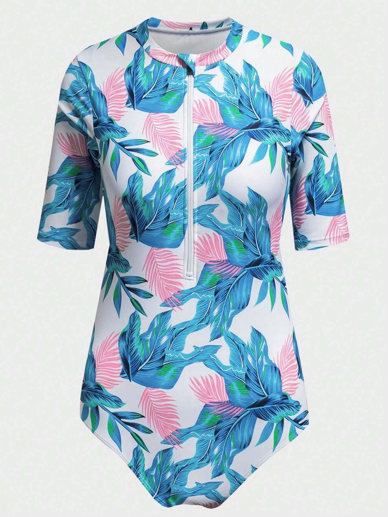 White one-piece rashguard with blue and pink leaf print, half sleeves, and front zip.