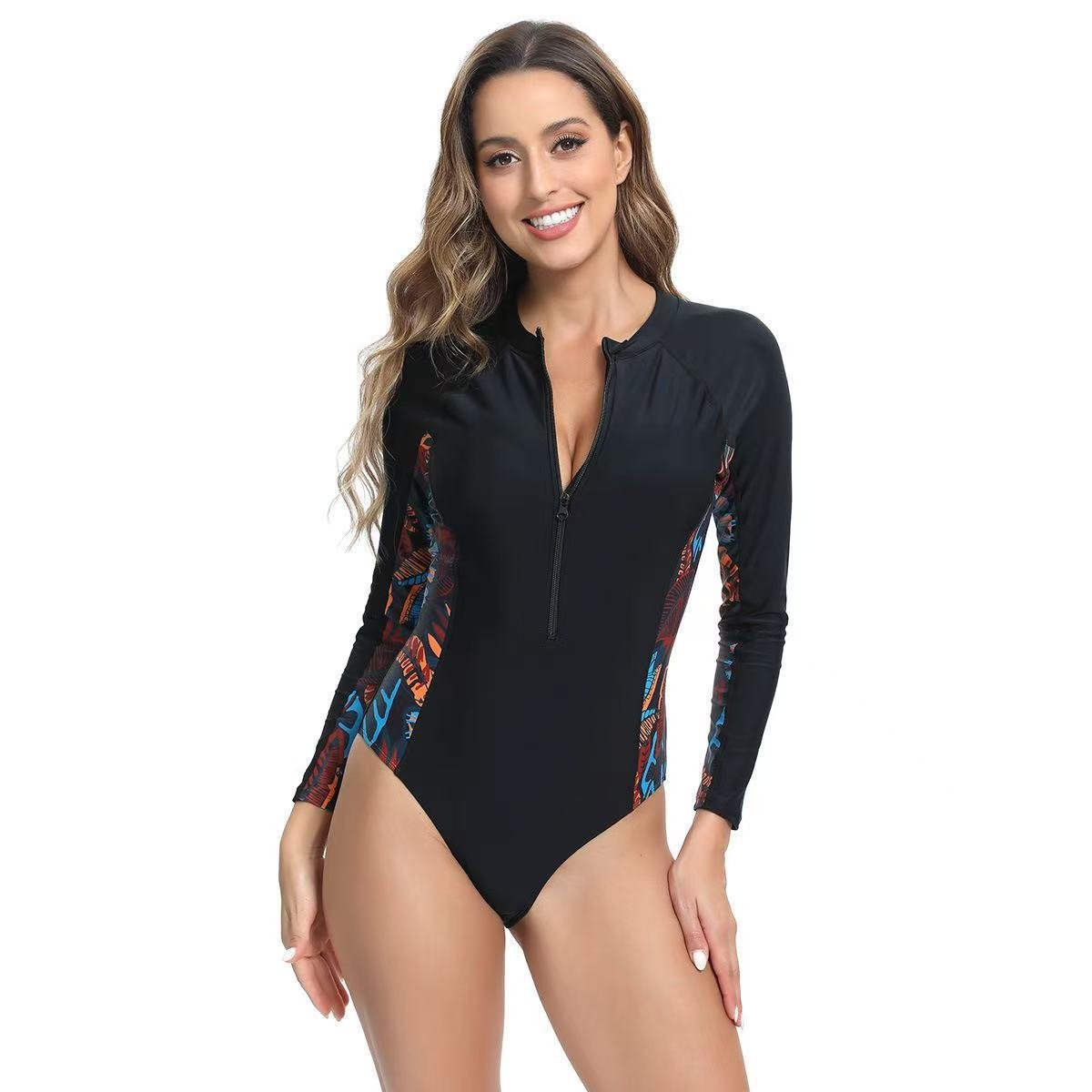 Black long-sleeve one-piece swimsuit featuring a front zipper and colorful patterned side panels.