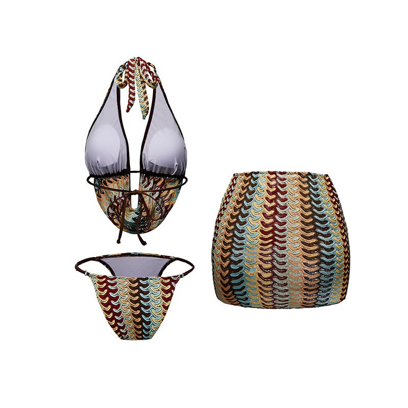 Three-piece swim set featuring a halter plunge top with ring detail, patterned bikini bottoms, and a high-waisted mini