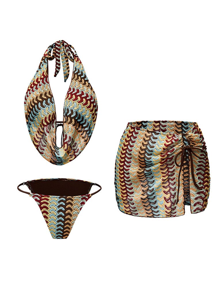 Patterned three-piece swimwear set including a halter plunge bikini top, bikini bottom, and high-waisted mini skirt with side