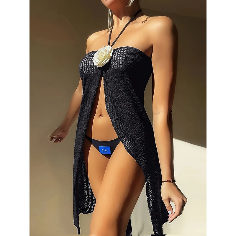 Black textured open-front maxi cover-up dress with a white flower detail over a bikini.