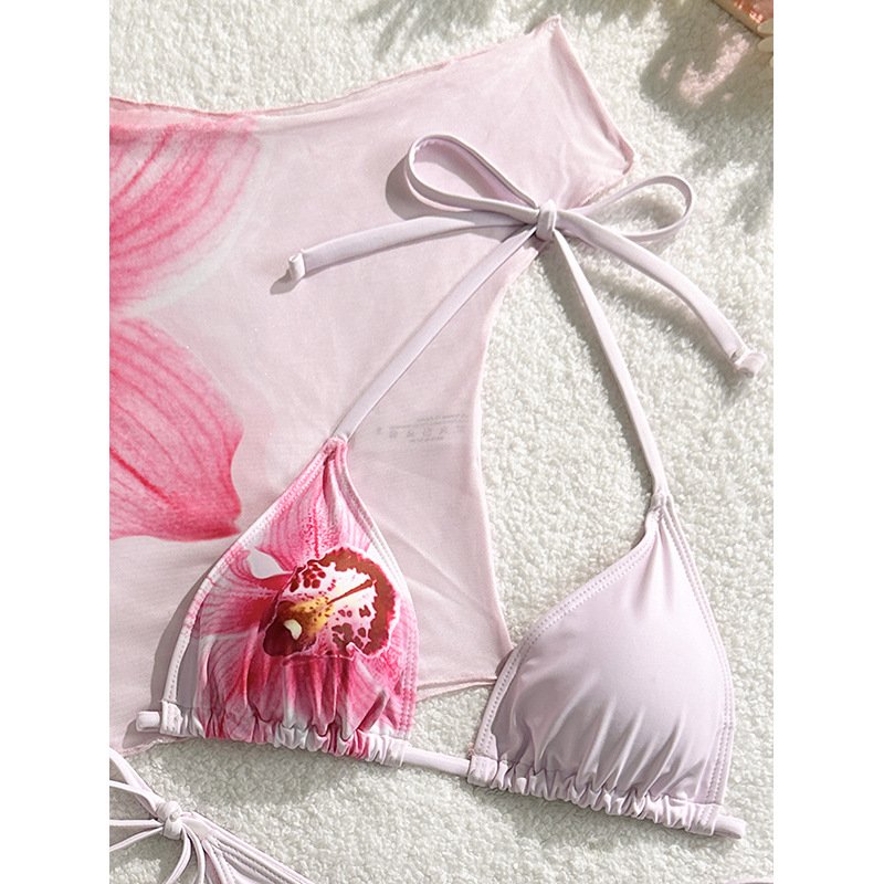 Pink floral print triangle bikini set with halter neck top and matching off-shoulder mesh cover-up.