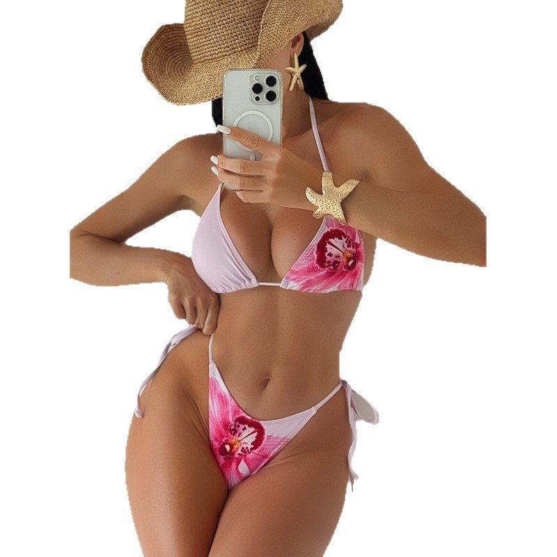 Pink and white floral print triangle bikini set with side-tie bottoms.