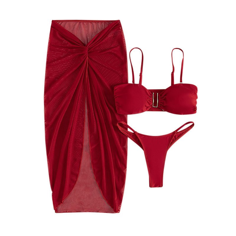 Red three-piece bikini set featuring a bandeau top with metal ring detail, thong bottoms, and a sheer high-waisted