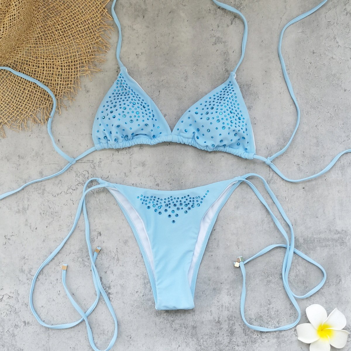 Light blue rhinestone triangle bikini set with tie-neck top and string-side bottoms.