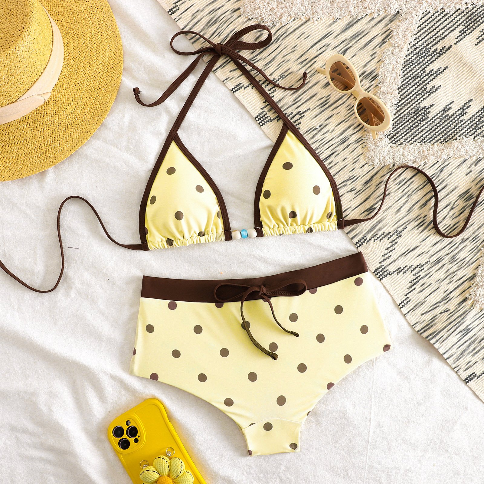 Yellow polka dot triangle halter bikini set with brown trim and matching boyshort bottoms.
