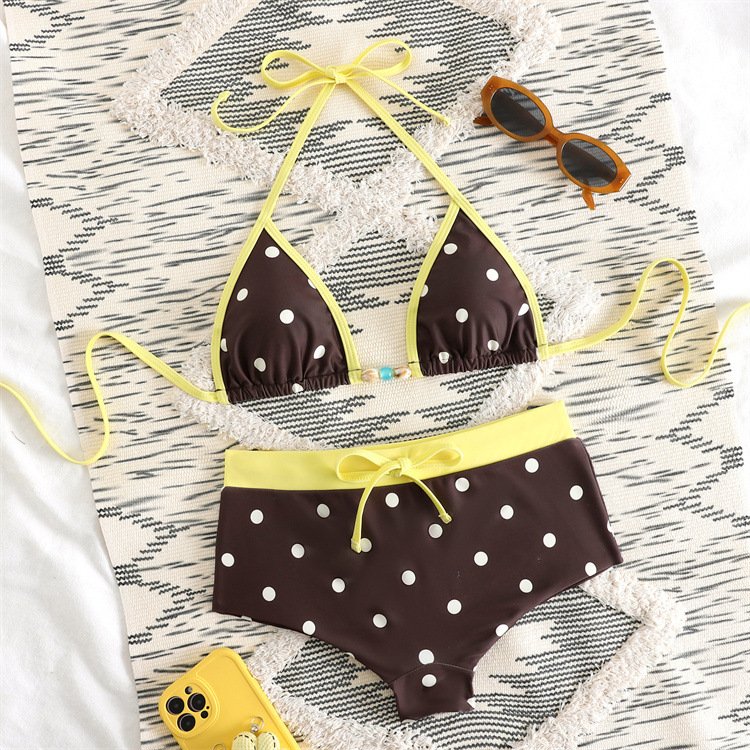 Brown and white polka dot bikini set with yellow contrast trim, featuring a triangle halter top and boyshort