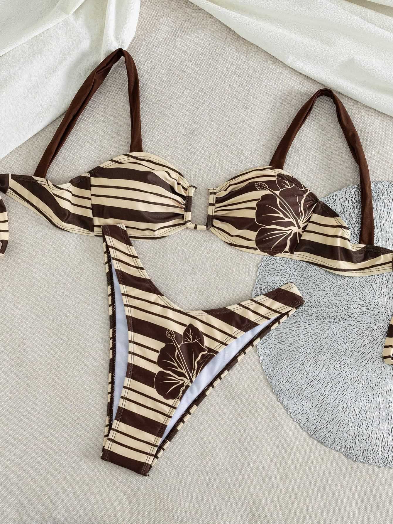 Brown and beige striped bikini set with floral print, featuring an underwire halter top and cheeky bottoms.