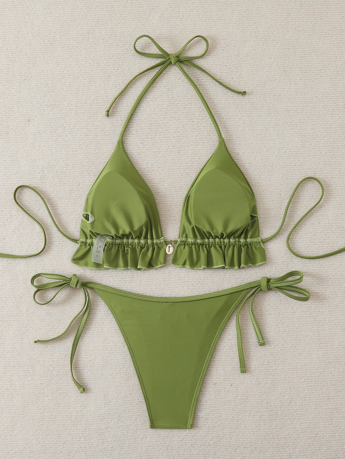 Green ruffle-trim halter triangle bikini set with tie-side bottoms.