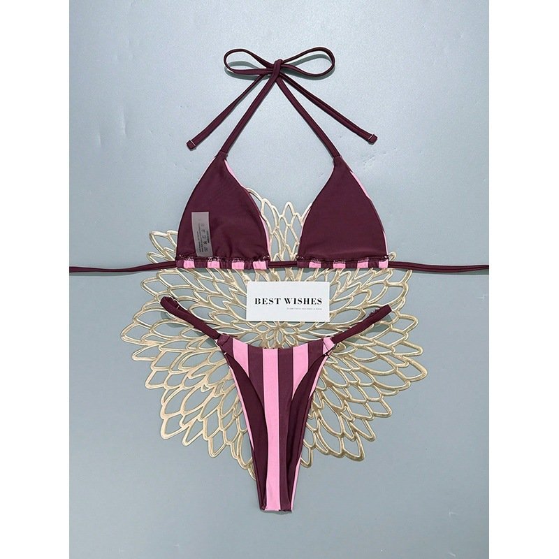 Burgundy and pink striped halter triangle bikini set with side-tie bottoms.