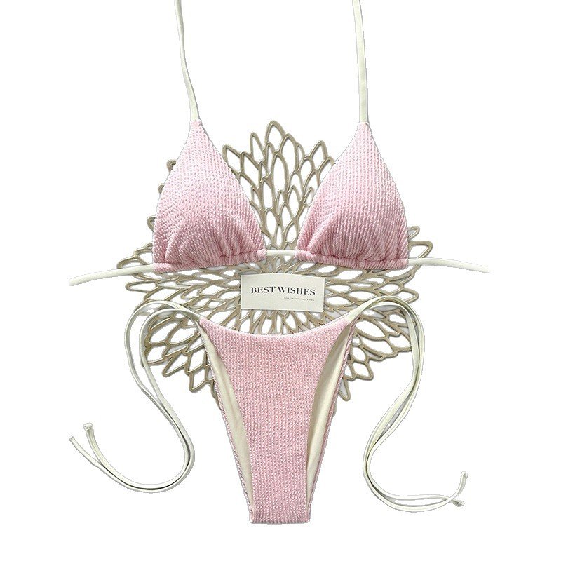 Pink textured reversible triangle bikini set featuring adjustable halter straps and side ties.