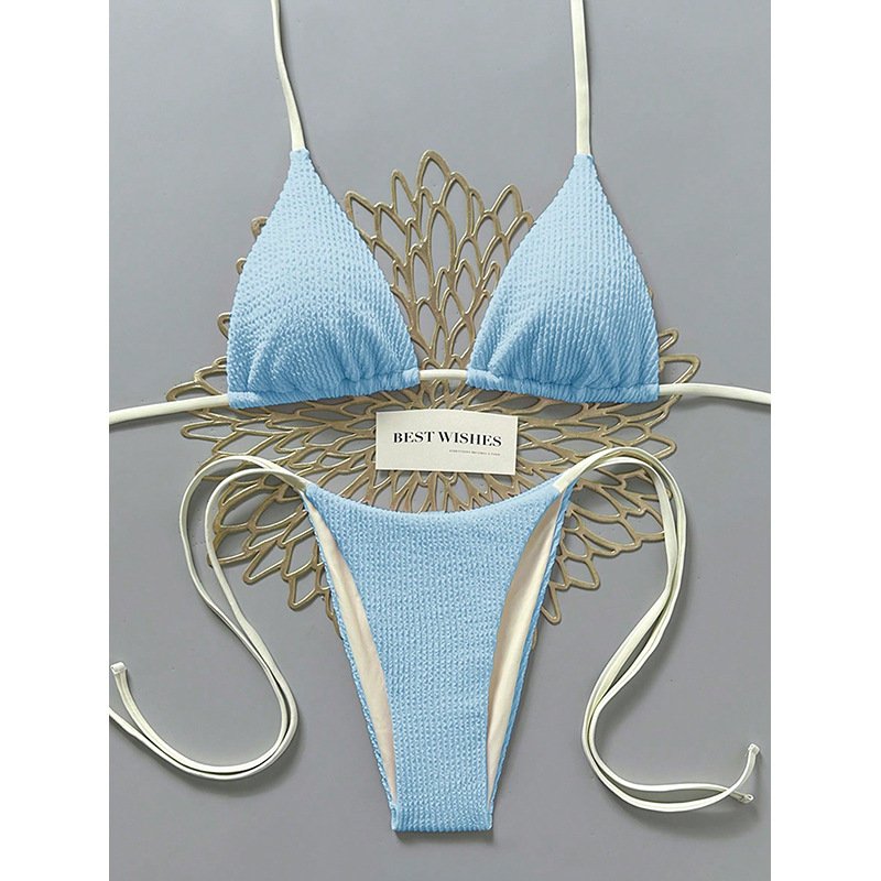 Light blue reversible textured triangle bikini set with white side ties and halter straps.