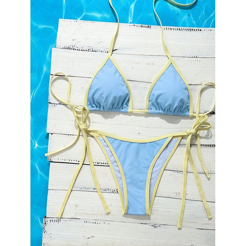 Blue triangle bikini set with yellow contrast piping, halter top, and tie-side bottoms.