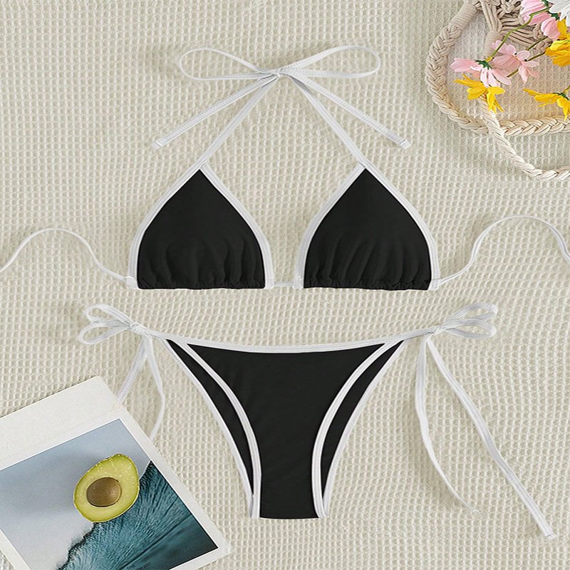 Black and white contrast piping halter triangle bikini set with tie sides.