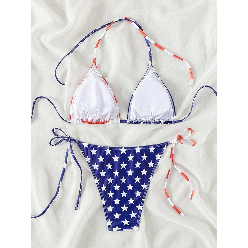 A two-piece bikini set featuring a white triangle top with red and blue trim and blue bottoms with