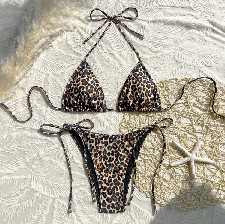 Leopard print tie-strap triangle bikini set with halter neck top and adjustable side-tie bottoms.