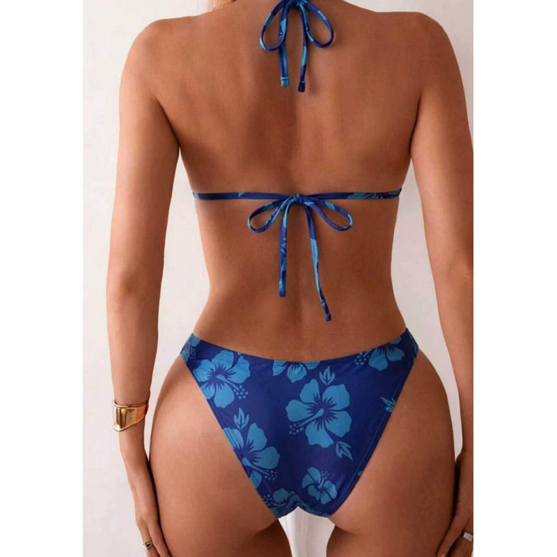 Back view of a blue floral print tie-neck triangle bikini set with self-tie back straps.