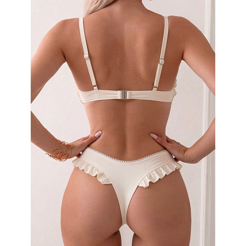 Back view of a cream two-piece bikini set featuring adjustable straps, a hook-back closure, and ruffled bottom details.