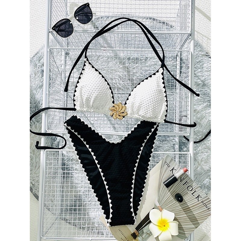 Black and white scalloped edge triangle bikini set with gold center detail.