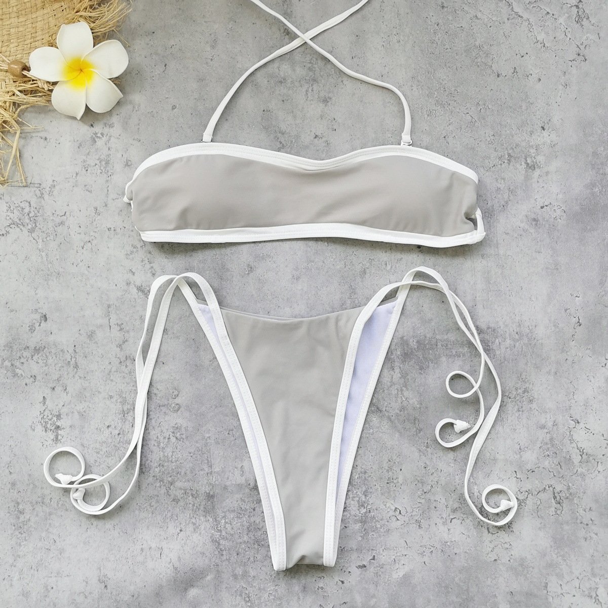 Grey convertible strapless bandeau bikini set with white contrast piping and adjustable side ties.