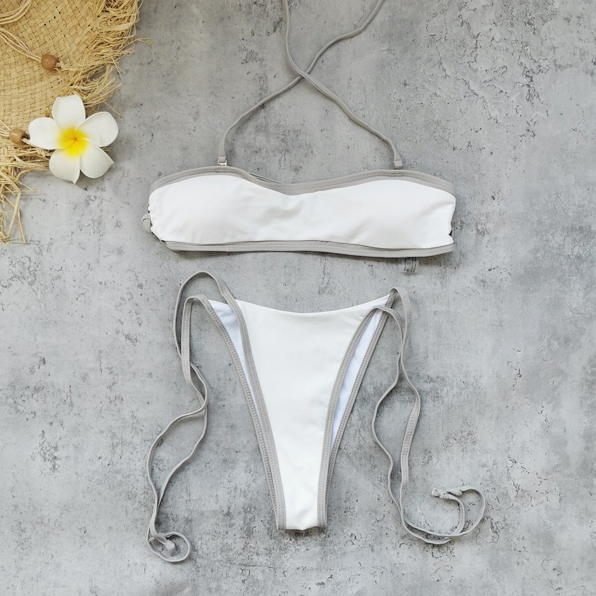 White convertible strapless bandeau bikini set with grey contrast piping and adjustable side ties.