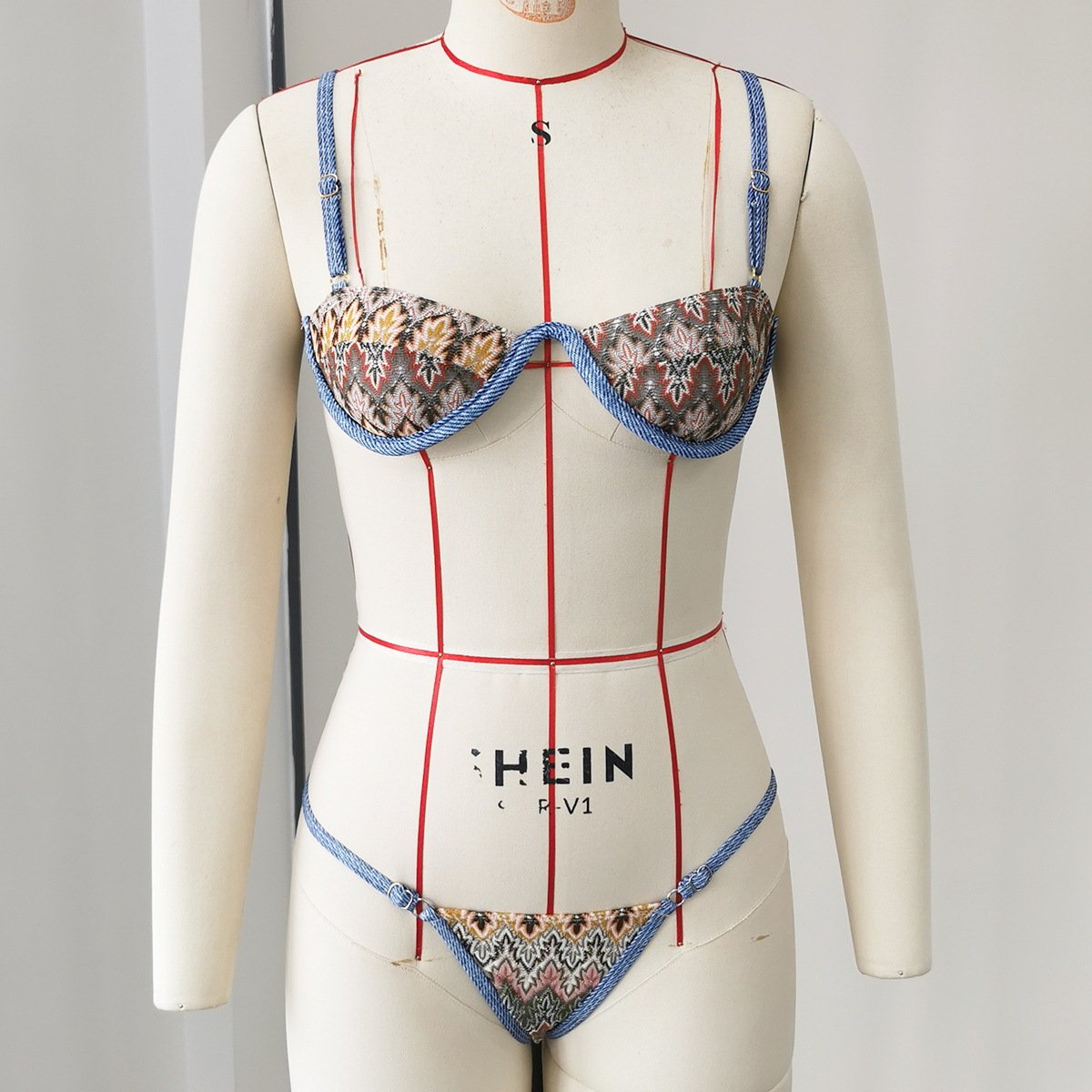 Patterned underwire bikini set with adjustable straps and tie-side bottoms.